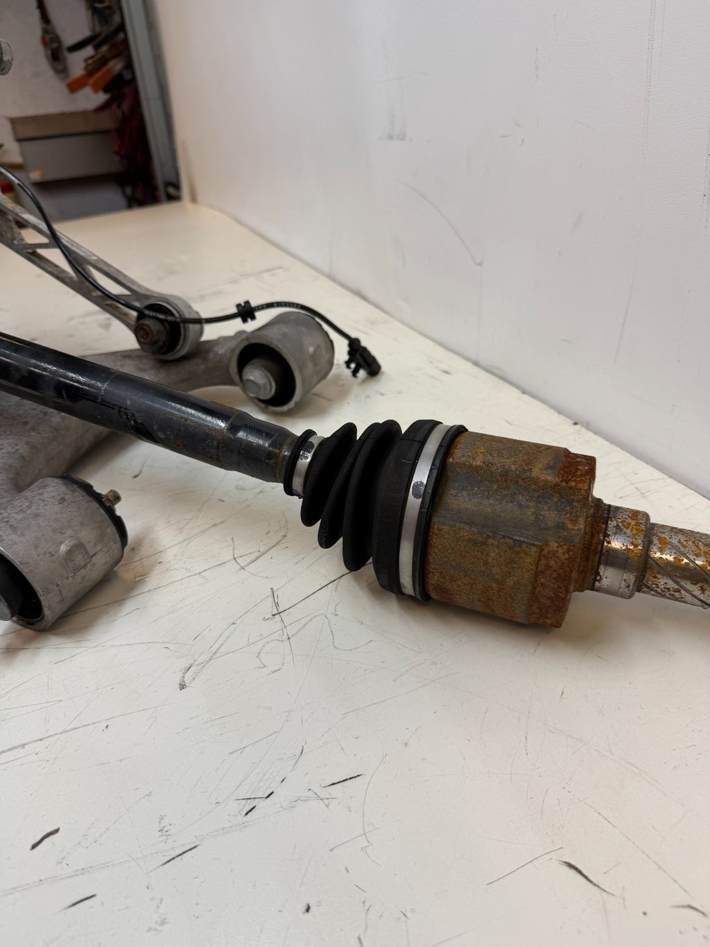 2016–2020 Tesla Model X Rear Left Suspension Knuckle Assembly w/ CV Axle OEM
