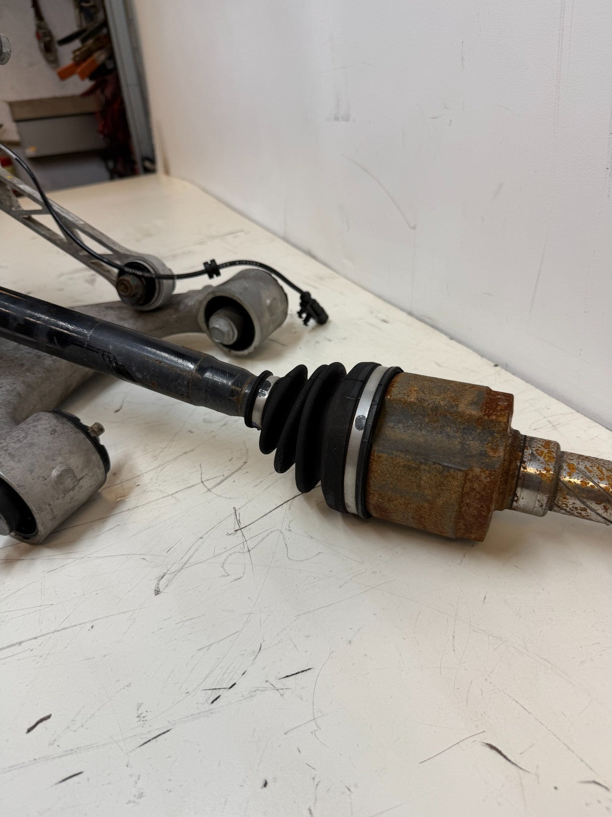 2016–2020 Tesla Model X Rear Left Suspension Knuckle Assembly w/ CV Axle OEM