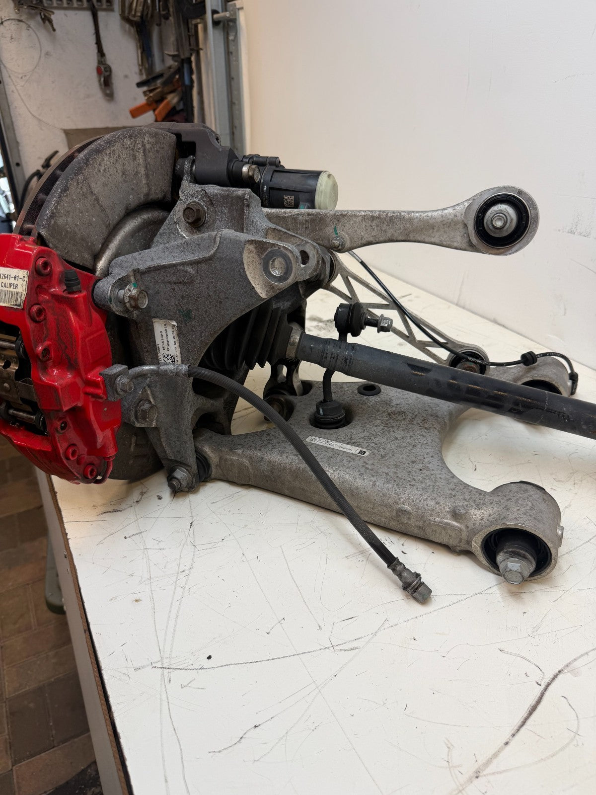 2016–2020 Tesla Model X Rear Left Suspension Knuckle Assembly w/ CV Axle OEM