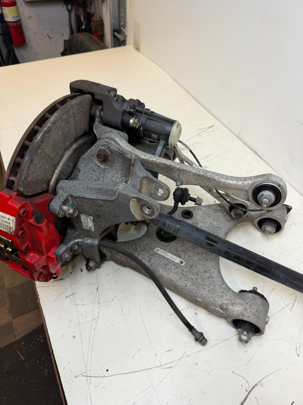 2016–2020 Tesla Model X Rear Left Suspension Knuckle Assembly w/ CV Axle OEM