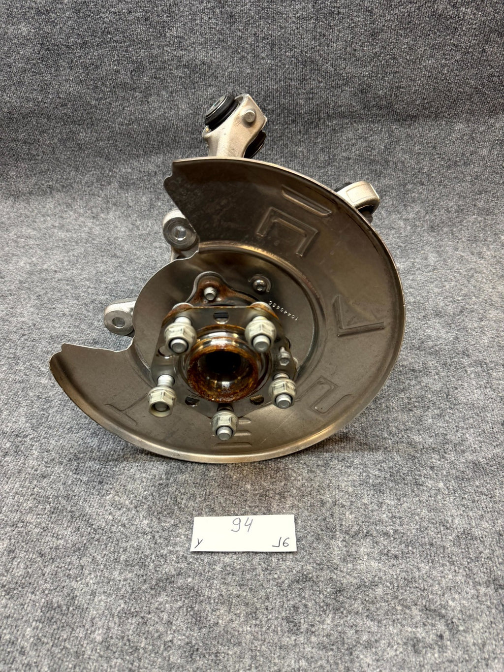 2020-2024 TESLA MODEL Y REAR LEFT SPINDLE KNUCKLE HUB & SHIELD OEM, 1188411-00-G