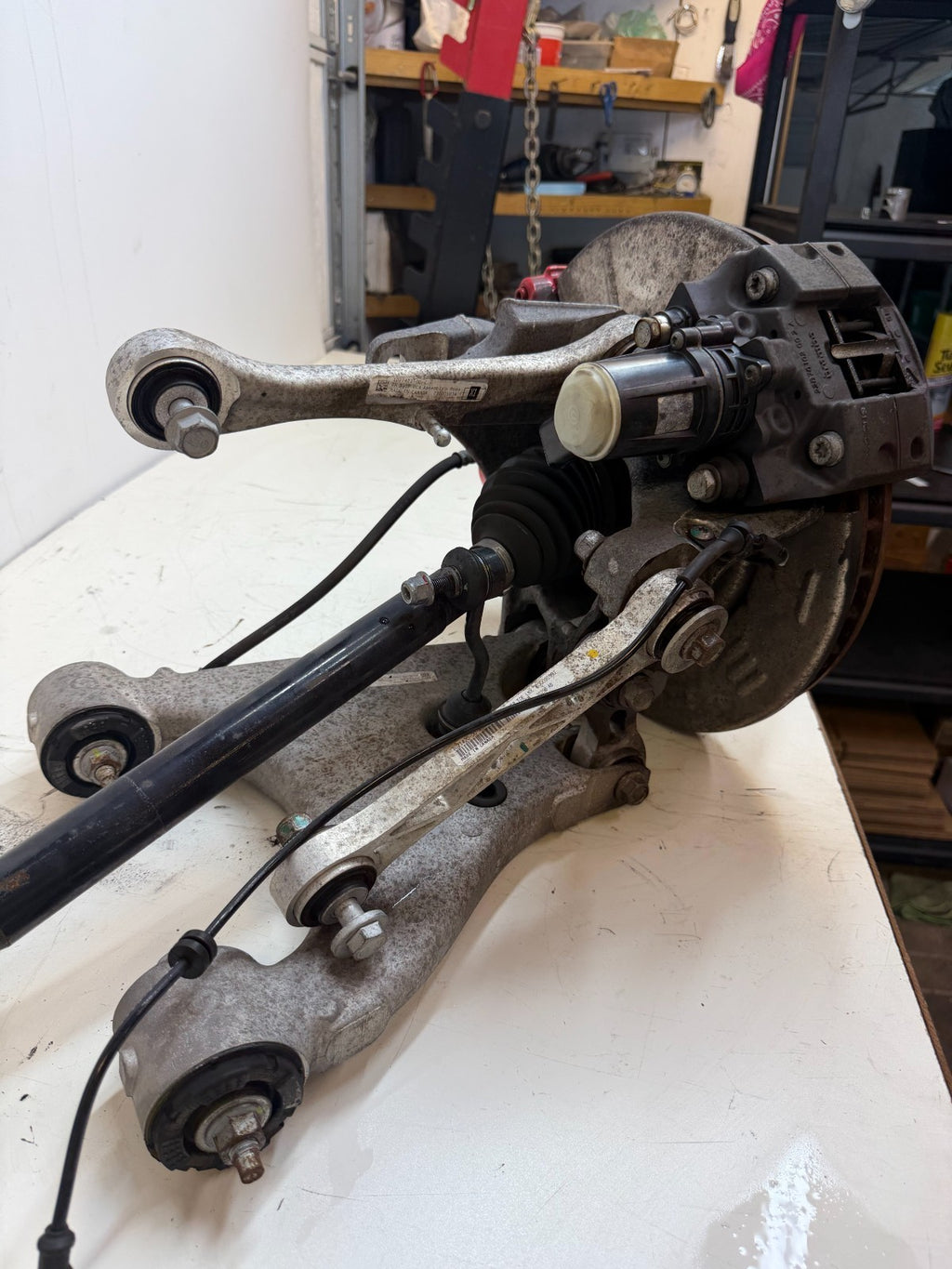 2016–2020 Tesla Model X Rear Left Suspension Knuckle Assembly w/ CV Axle OEM
