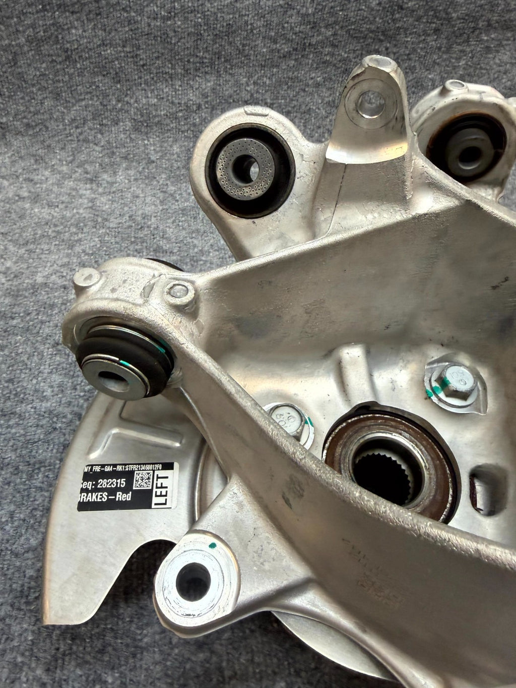 2020-2024 TESLA MODEL Y REAR LEFT SPINDLE KNUCKLE HUB & SHIELD OEM, 1188411-00-F
