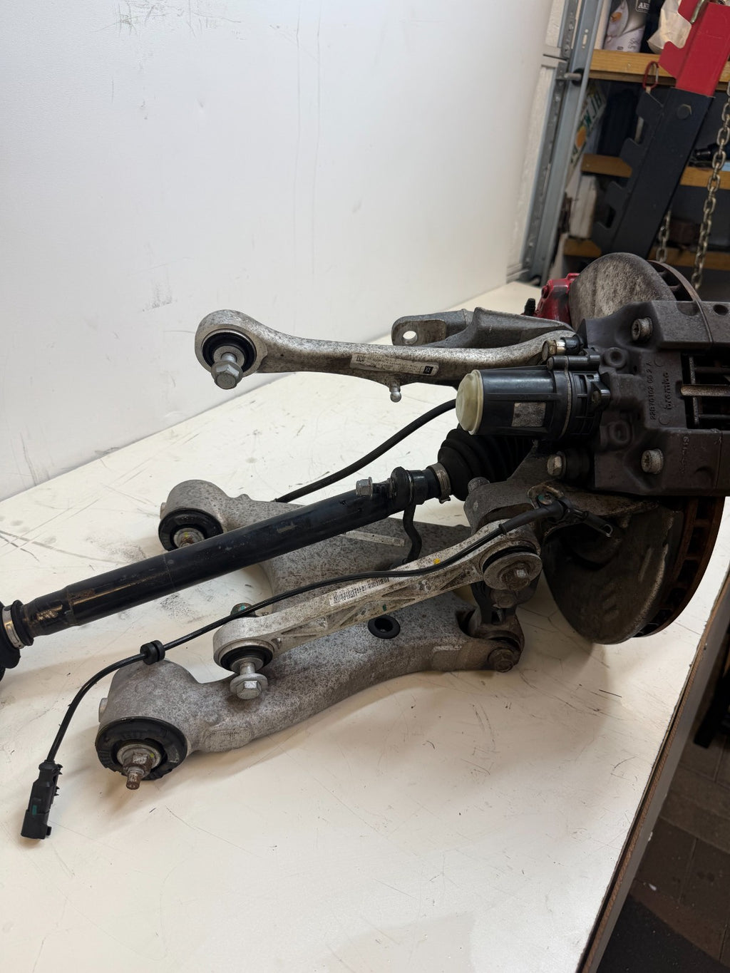 2016–2020 Tesla Model X Rear Left Suspension Knuckle Assembly w/ CV Axle OEM