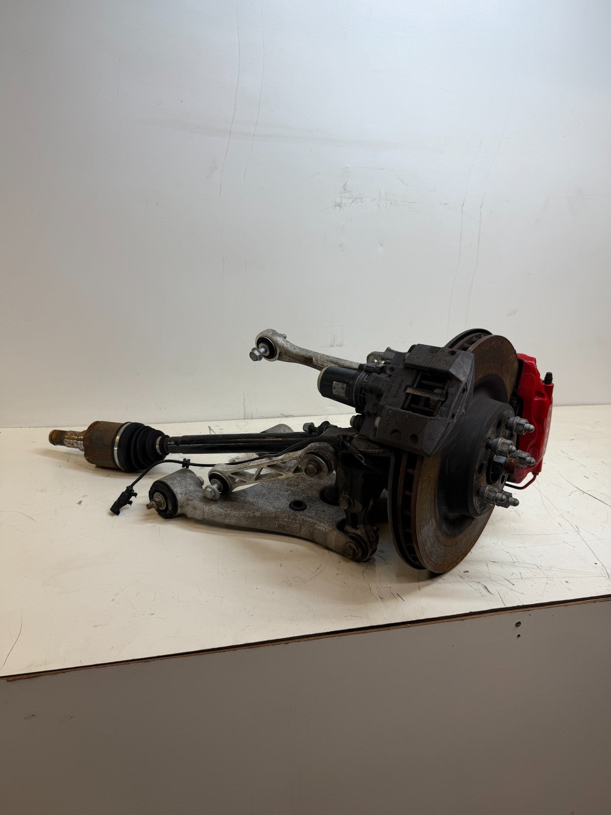 2016–2020 Tesla Model X Rear Left Suspension Knuckle Assembly w/ CV Axle OEM