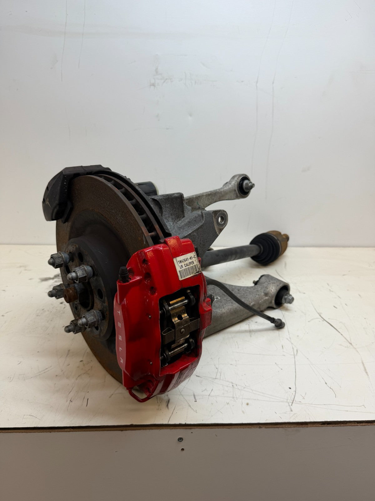 2016–2020 Tesla Model X Rear Left Suspension Knuckle Assembly w/ CV Axle OEM